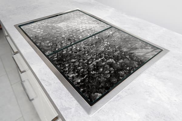 GLASSKYDDSPLÅT FÖR SPIS 85x52 DROPS