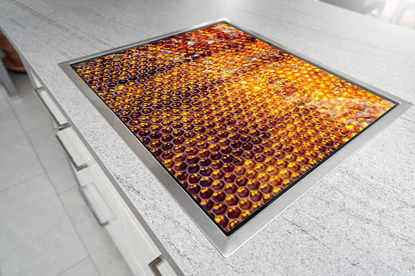 GLASSKYDDSPLÅT FÖR SPIS 70x52 HONEY