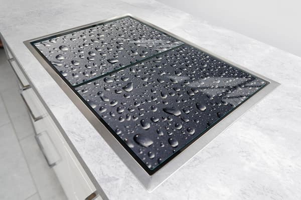 GLASSKYDDSPLÅT FÖR SPIS 70x52 DROPS