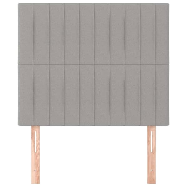 Sänggavel ljusgrå 100x5x118/128 cm tyg