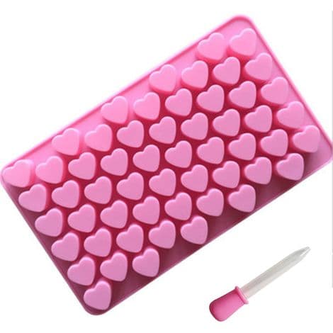 En mini hjerteformet silikoneform med 55 små huller - pink