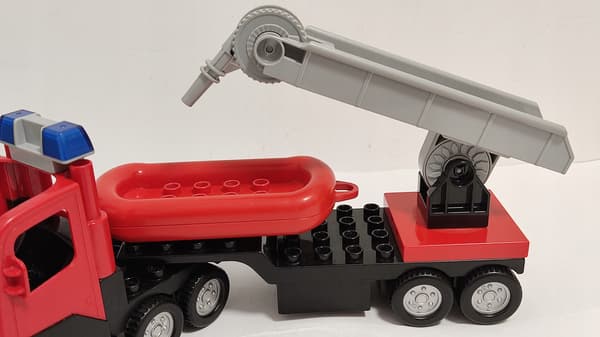 Lego Duplo building blocks: car, fire engine, trailer, ladder, dinghy