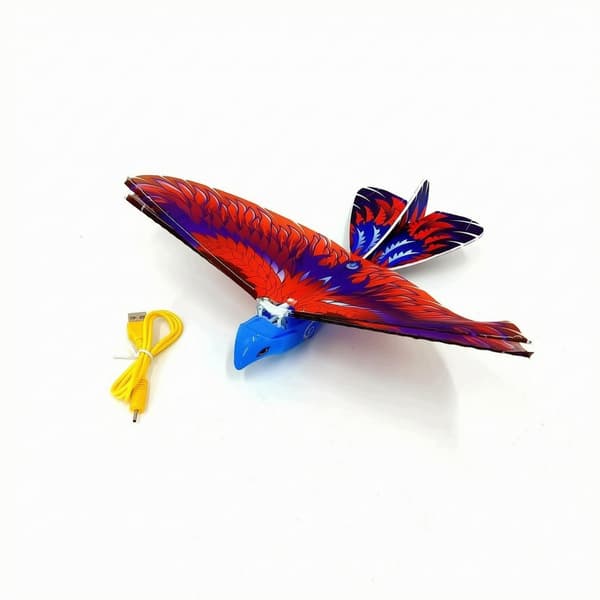Battery-powered remote-controlled flying bird with a blue, articulated, hand-thrown design