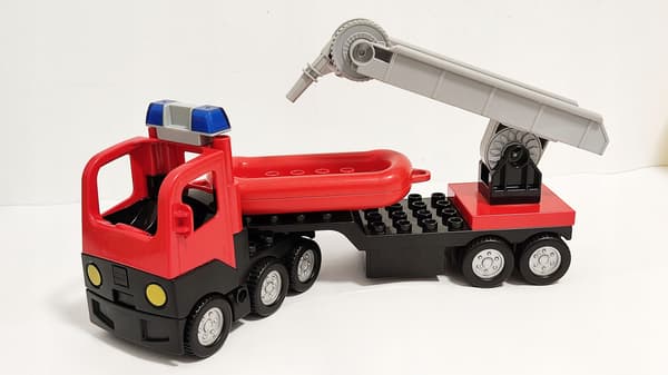 Lego Duplo building blocks: car, fire engine, trailer, ladder, dinghy