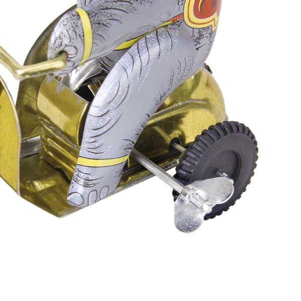 Wind-up clockwork elephant on a tricycle with a revolving ball, retro