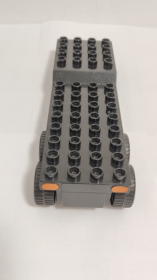 Lego Duplo building blocks: car, fire engine, trailer, ladder, dinghy