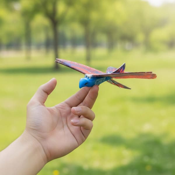 Hand-launched electric flying toy featuring a multi-coloured red bird for hand-launching