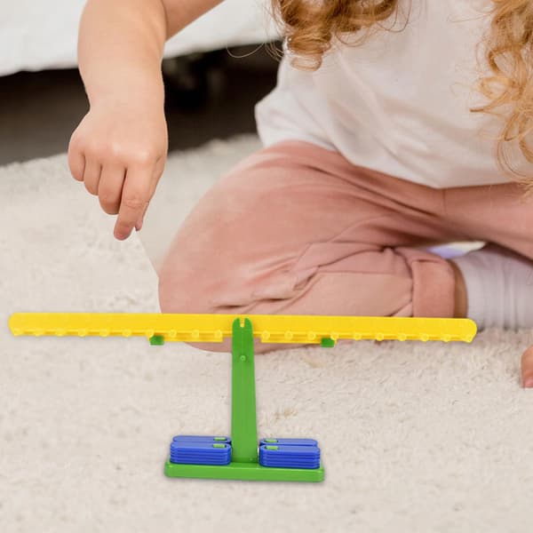 The children’s balance scale set includes 20 ‘Manipulative Maths’ weights for girls
