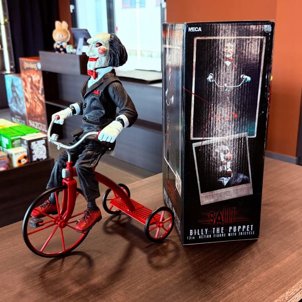 A 12-inch Billy the Dollmaker figurine with a tricycle, Display