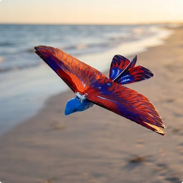 Hand-launched electric flying toy featuring a multi-coloured red bird for hand-launching