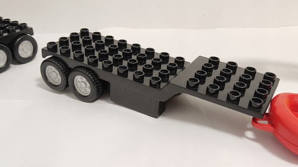 Lego Duplo building blocks: car, fire engine, trailer, ladder, dinghy