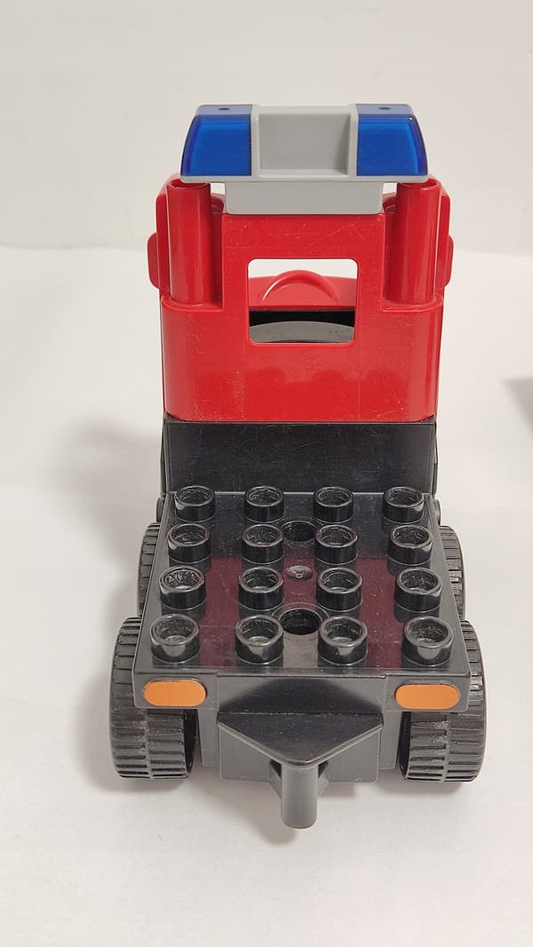 Lego Duplo building blocks: car, fire engine, trailer, ladder, dinghy