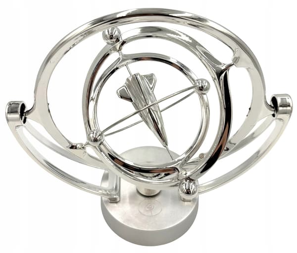 Battery-powered perpetual motion machine with a rocket – decorative silver rocket, space-themed ornament