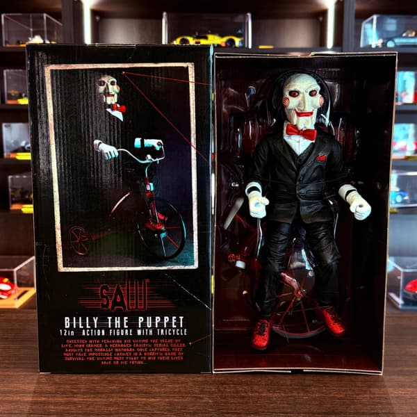 A 12-inch Billy the Dollmaker figurine with a tricycle, Display