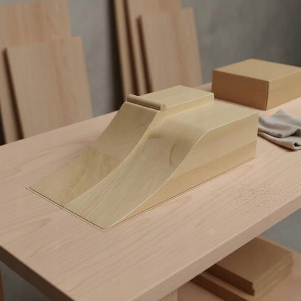 A solid wood toe-skate ramp for practising Ollies, with an elegant design – Location G
