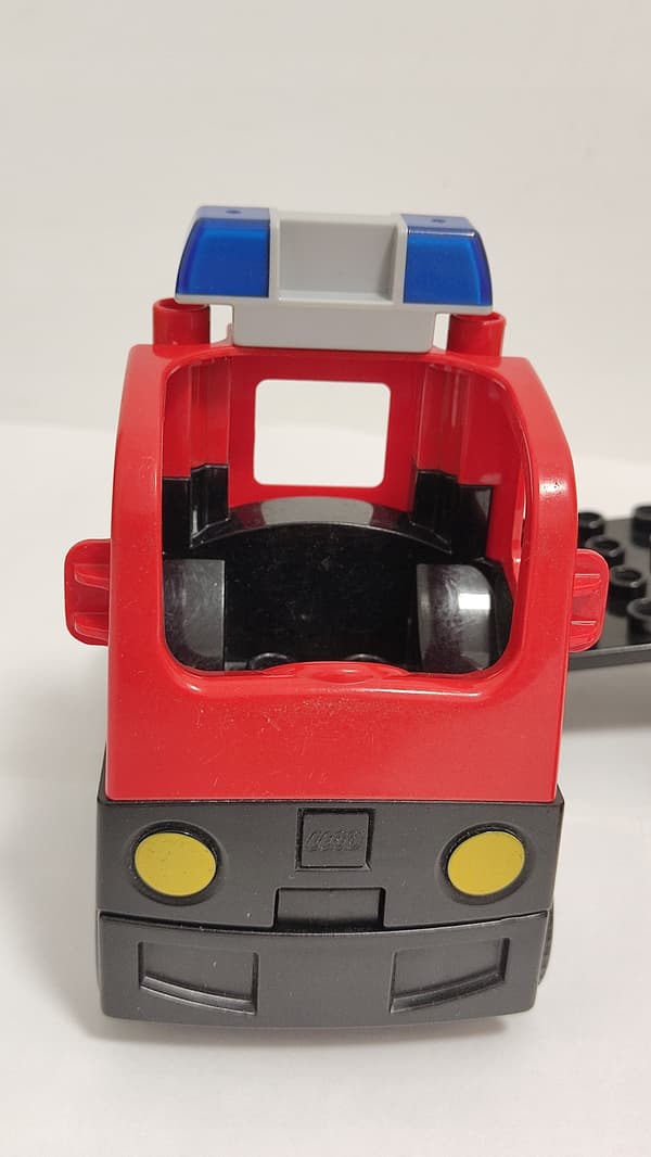 Lego Duplo building blocks: car, fire engine, trailer, ladder, dinghy