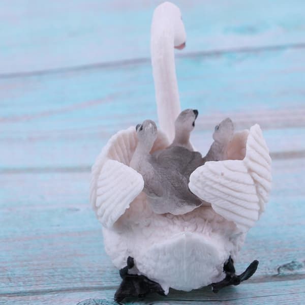 Realistic white swan with baby figurines; Animal figurines; Easter eggs; Cake
