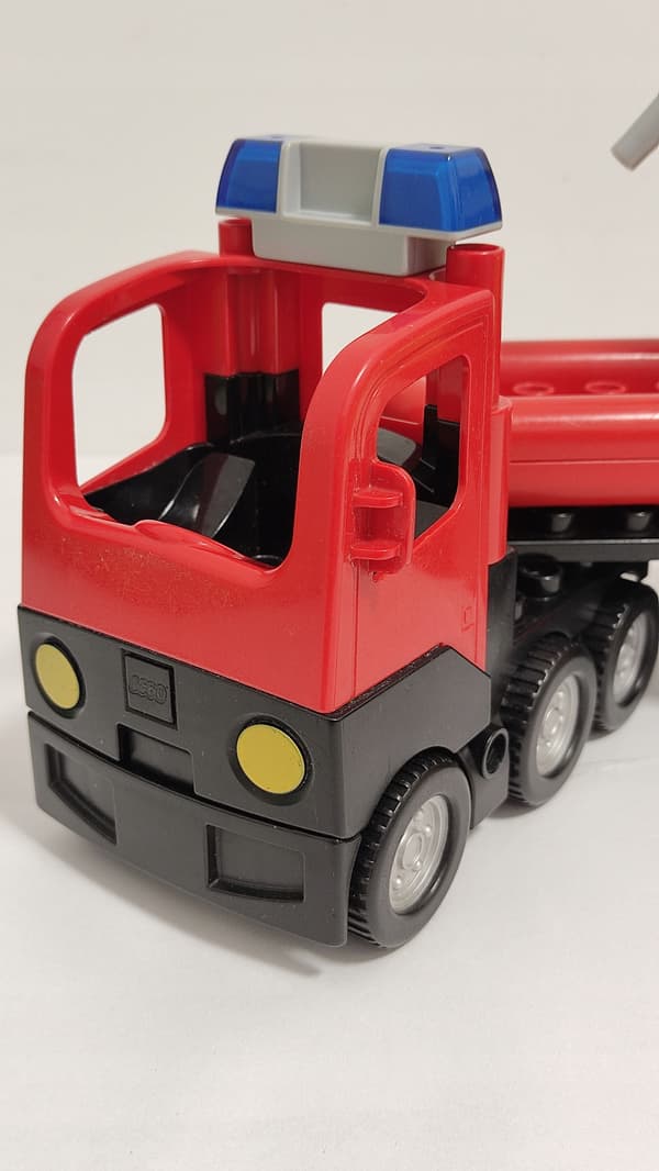 Lego Duplo building blocks: car, fire engine, trailer, ladder, dinghy