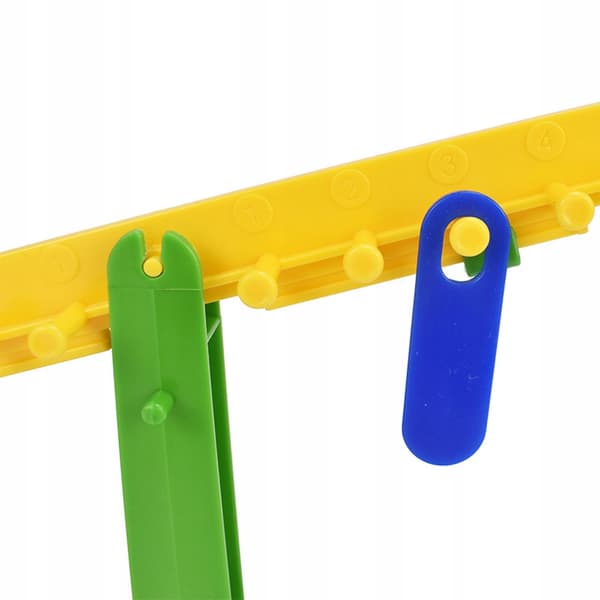 The children’s balance scale set includes 20 ‘Manipulative Maths’ weights for girls