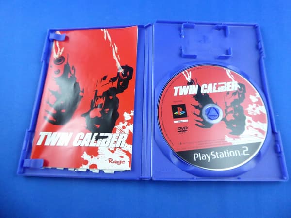 TWIN CALIBER album, very good+ condition, complete PS2 set