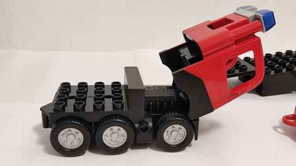 Lego Duplo building blocks: car, fire engine, trailer, ladder, dinghy